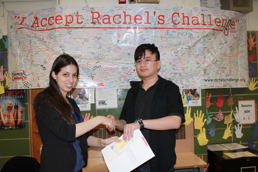 Our English teacher, Ms. Binaso, presents Yu Xiong with a congratulations letter from Scholastic Scope Magazine and a Visa gift card!